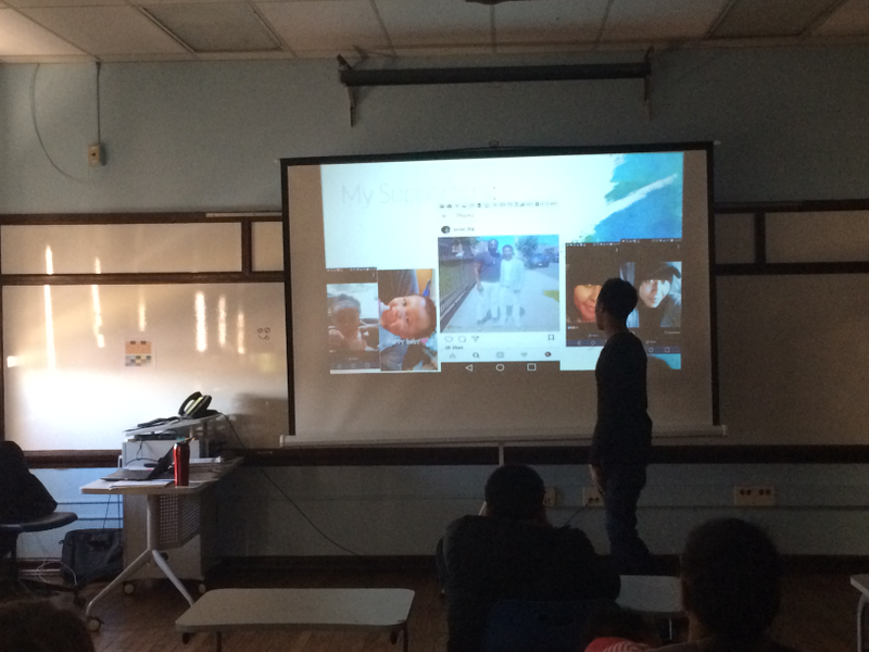 Ryan Moten, whose mother and grandmother also attended school in the Vaux building, speaks to an audience of peers, teachers and families as part of a weeklong program of student presentations.